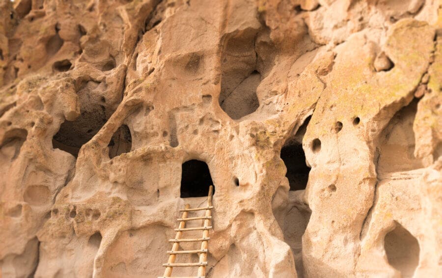 Witness how Native American lived in cliff dwelling caves at Bandelier National Monument while RV camping in New Mexico.