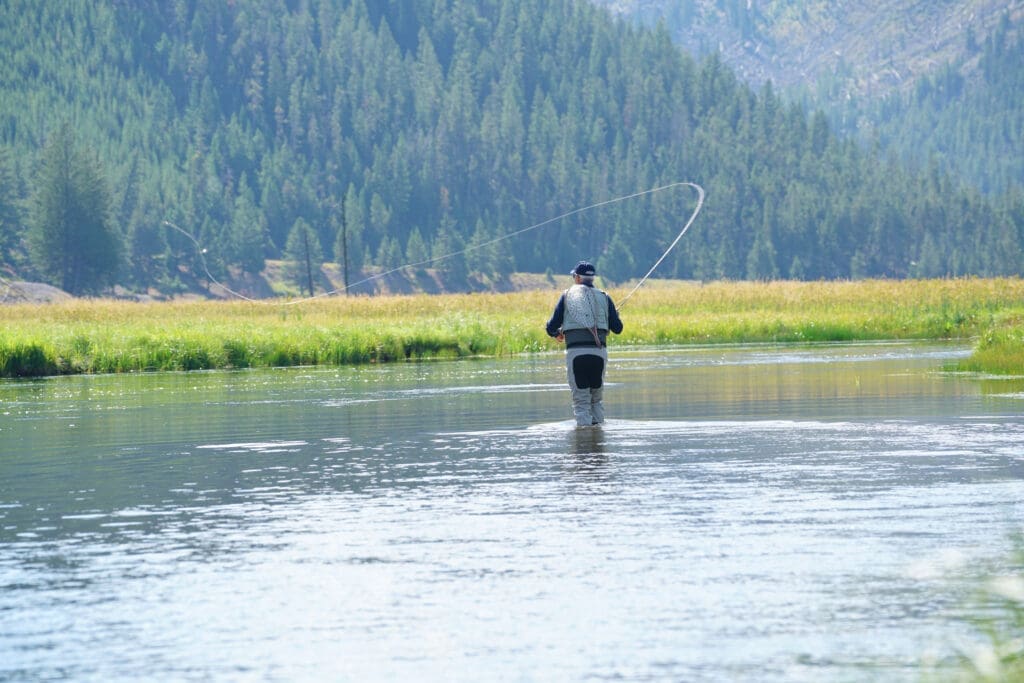 Person fly-fishing in Yellowstone